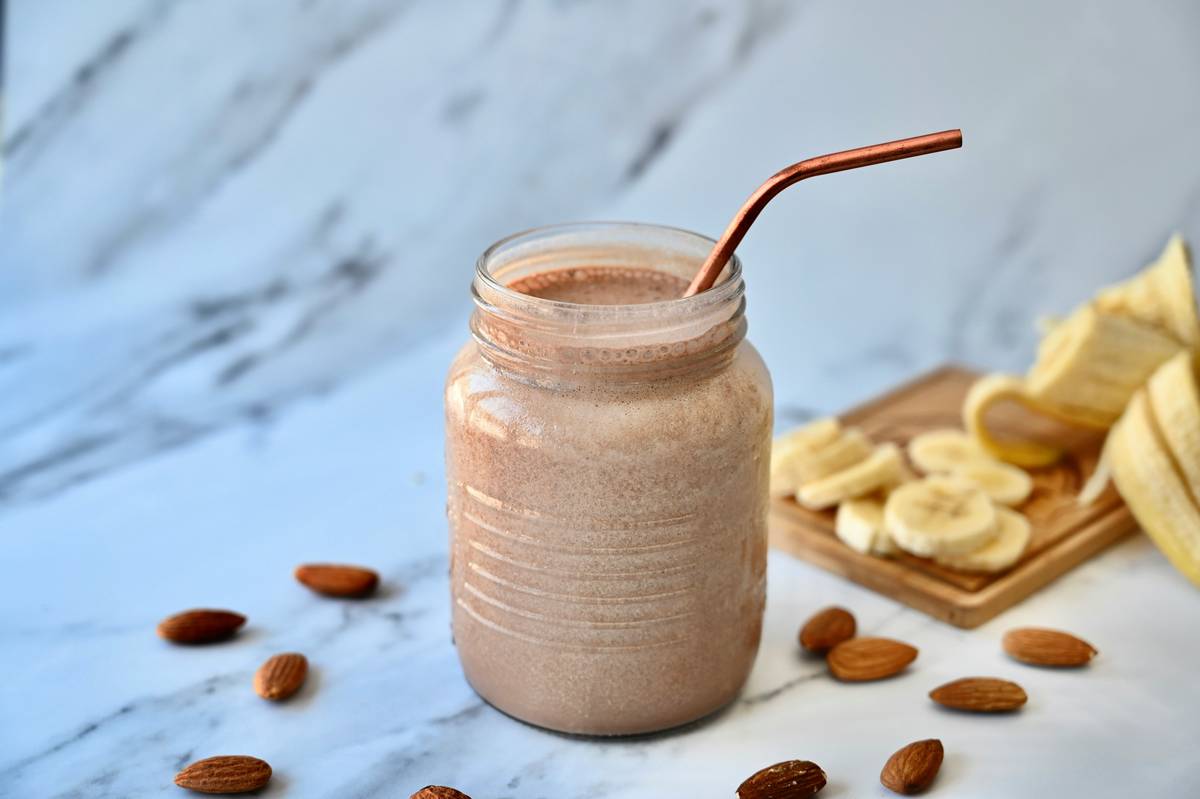 fresh start smoothie blend organic being prepared with wild blueberries, hemp seeds, and turmeric in a glass blender